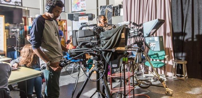 Two students working television cameras.